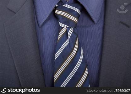 detail of a business man with blue tie