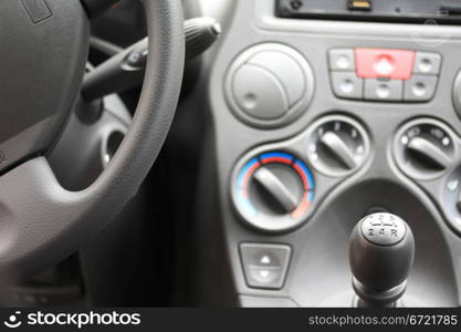 detail of a car interior, stick shift car