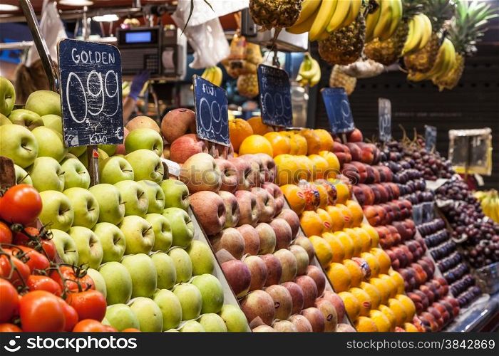 Detail of a colorful fruit market interior, prices in euro