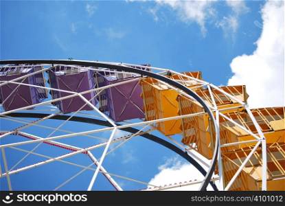 Detail of a ferris wheel in the sky. Popular attraction in the park