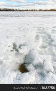 Detail of a hole in the ice on the frozen Dnieper river in Kiev, Ukraine