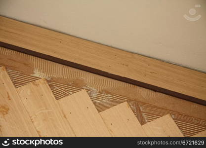 Detail of a parquetry wooden floor in fishbone pattern