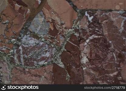 detail of a piece of red marble with an interesting pattern