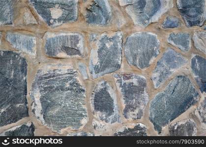 Detail of a stone wall construction as a background image