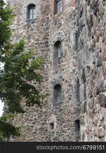 Detail of a stone wall of the fortress protection. fragment of old city stone wall