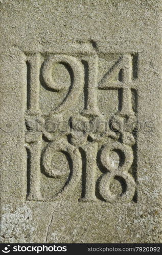 Detail of a UK war memorial with dates of WWI 1914 1918.