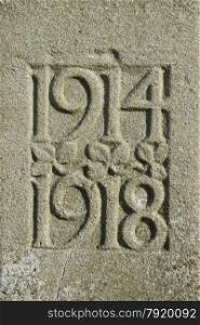 Detail of a UK war memorial with dates of WWI 1914 1918.