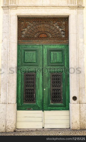 Detail of a vintage door on an old building in the historic center of Lisbon, Portugal