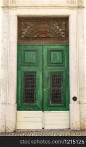 Detail of a vintage door on an old building in the historic center of Lisbon, Portugal