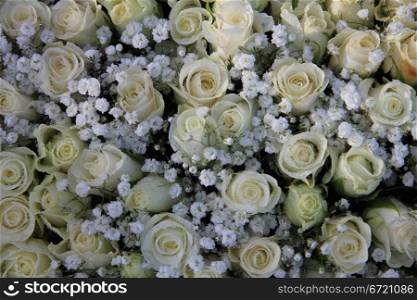 Detail of a wedding bouqquet with white roses and gypsophila