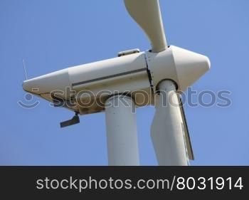 Detail of a wind turbine, standing still in a clear blue sky
