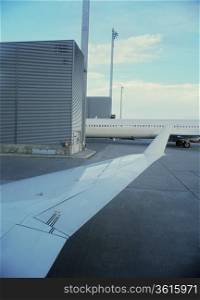 Detail of airplane wing in airport