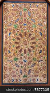 Detail of an ancient wooden arab door, example of islamic art. Marrakech, Maroc, Africa.