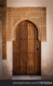 Detail of ancient door in Alhambra UNESCO site - Spain, decorations 800 years old