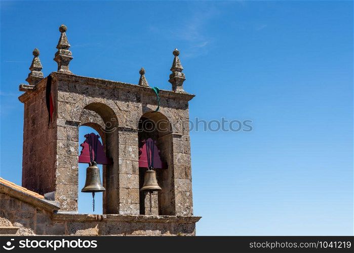 Detail of bell tower of the Rocamador church for our Lady in Castelo Rodrigo in Portugal. Bells of ancient church for Our Lady of Rocamador in Castelo Rodrigo