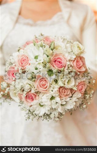 detail of bridal bouquet pink and white roses