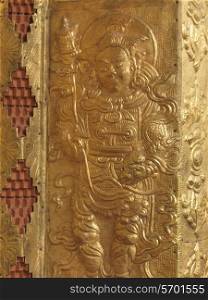 Detail of carvings on a wall of Punakha Monastery, Punakha, Bhutan