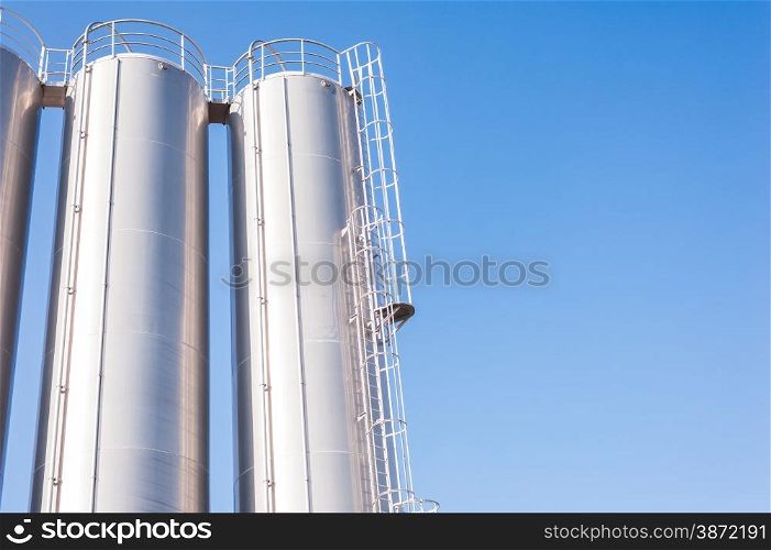 Detail of chemical plant, silos and pipes