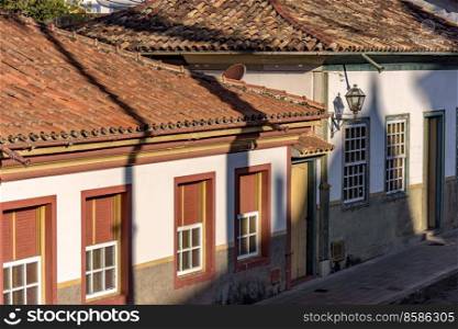 Detail of colonial style streets and houses in the old and historic city of Diamantina in Minas Gerais, Brazil during the late afternoon. Detail of colonial style streets and houses in Dimantina