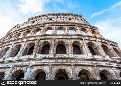 Detail of Colosseum in Rome  Roma , Italy. Also named Coliseum, this is the most famous Italian sightseeing. Spectacular blue sky in background.