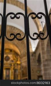 Detail of decorative wrought iron fence in a catholic church; Majorca, Balearic islands, Spain.