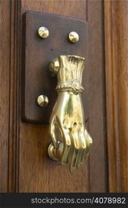 detail of door knocker on a building exterior