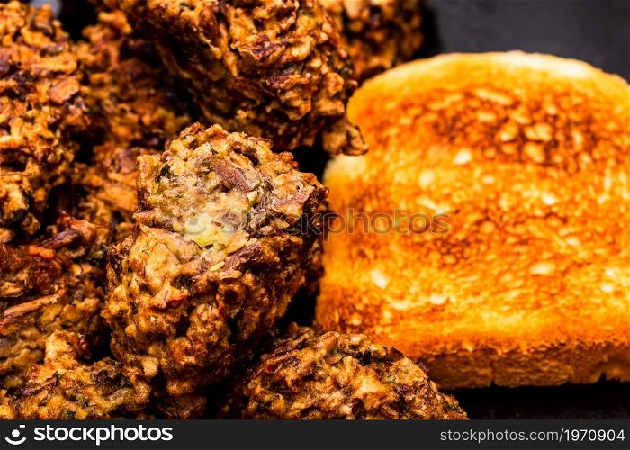 Detail of fresh fried meatballs with bread