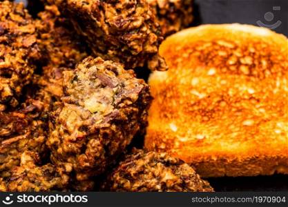 Detail of fresh fried meatballs with bread