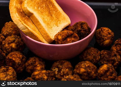 Detail of fresh fried meatballs with bread