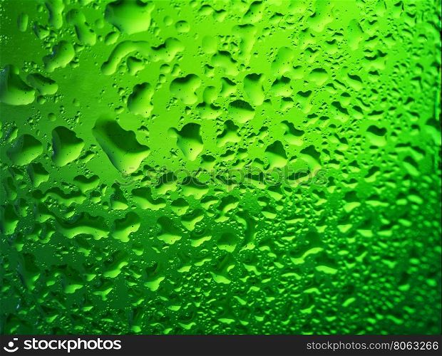 Detail of green bottle of beer with drops on the glass. Detail of green bottle of beer with drops
