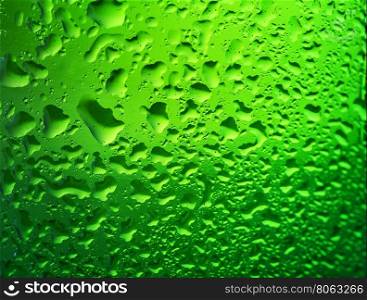 Detail of green bottle of beer with drops on the glass. Detail of green bottle of beer with drops