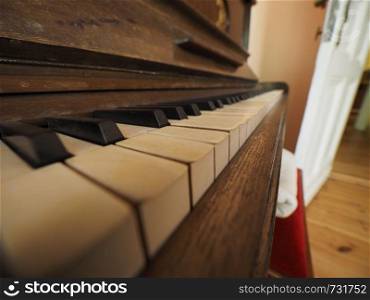 detail of piano keyboard keys on vintage instrument. detail of piano keyboard keys
