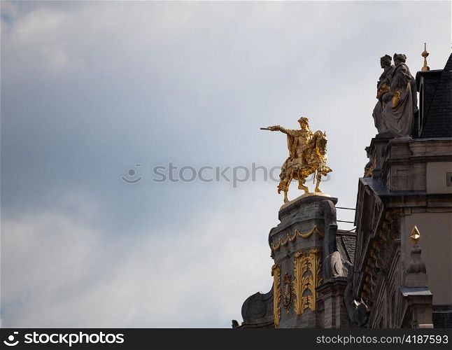 Detail of roof and gold statues on roof of Maison de Arbre in Grand Place Brussels
