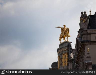 Detail of roof and gold statues on roof of Maison de Arbre in Grand Place Brussels