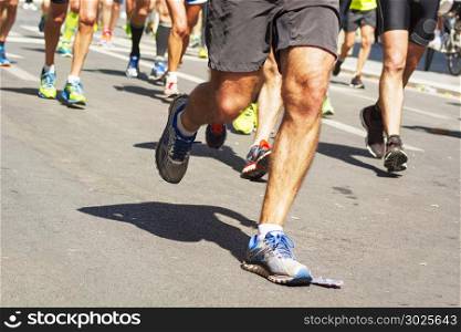 detail of running shoes of marathon runners