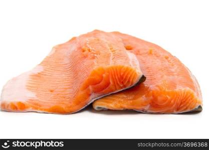 detail of salmon trout fillets over white background