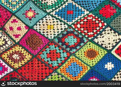 Detail of sewn crochet squares weaving