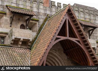 Detail of small doors and roofs in the palace of the Dukes of Braganza in Guimaraes in northern Portugal. Detail of the roof and walls of the palace of the Dukes of Braganza