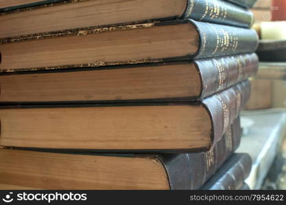 Detail of stacked on one another old books closeup