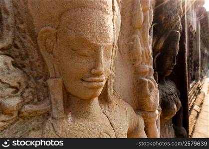 Detail of stone encarving Apsara. Detail of stone encarving Apsara at angkor wat