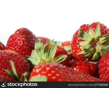 Detail of strawberries isolated over white with copy space. Strawberry