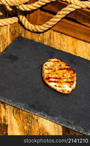 Detail of tasty pork steak on rustic background