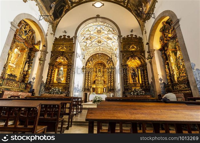 Detail of the Church of St Anthony interior, rebuilt after the 1927 fire and keeping the same Baroque style of all side chapels and main altar, in Estoril, Portugal