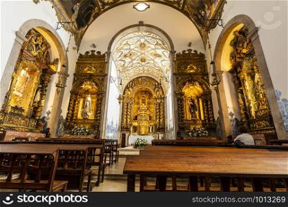 Detail of the Church of St Anthony interior, rebuilt after the 1927 fire and keeping the same Baroque style of all side chapels and main altar, in Estoril, Portugal