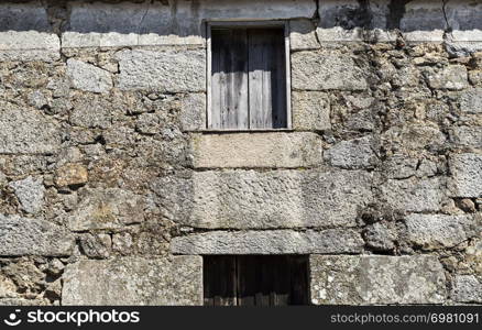 Detail of the construction of a traditional local granite house of the rural architecture of the Beira Alta region in Portugal