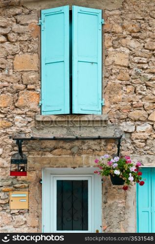 Detail of the Facade of French Home Decorated with Flowers