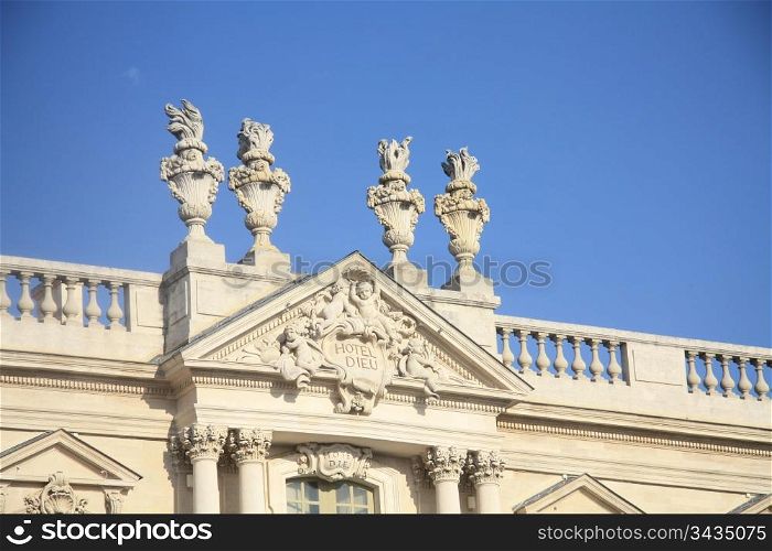 Detail of the facade of the townhall in Carpentras. Hotel-Dieu ( hostel of God) is the old name given to the principal hospital in French towns