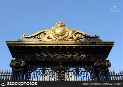 Detail of the golden gate at the justice palace in Paris