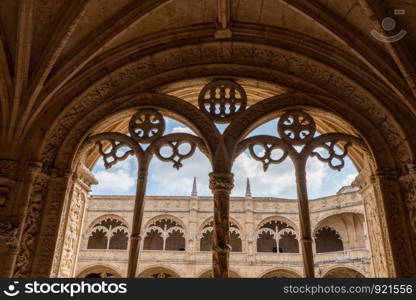 Detail of the magnificent carvings in the windows and cloisters inside the Monastery of Jeronimos in Belem. Cloisters inside Jeronimos Monastery in Belem near Lisbon, Portugal