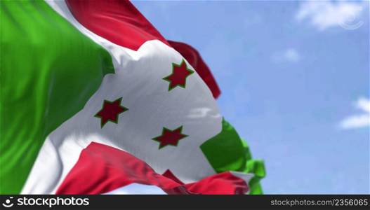 Detail of the national flag of Burundi waving in the wind on a clear day. Democracy and politics. Patriotism. Selective focus. Burundi is a landlocked country in East Africa